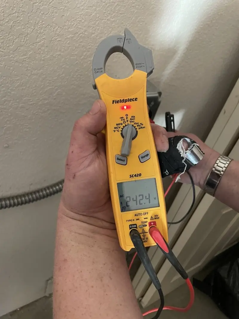 Voltage testing with clamp meter during Electrical Installation Services in Gantt